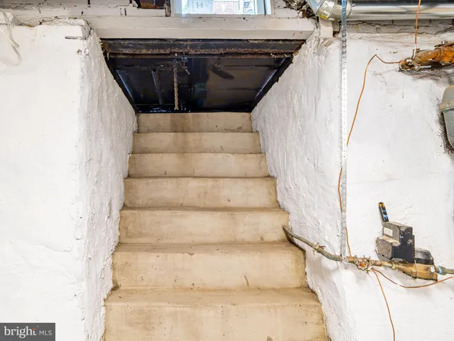 a view of an empty room with stairs