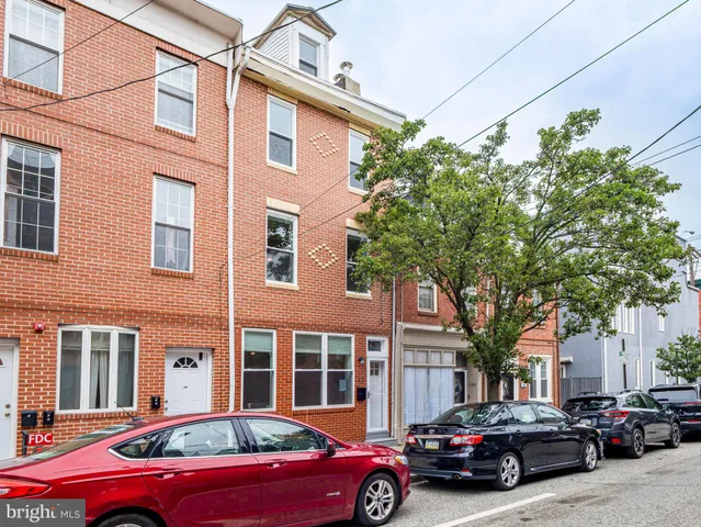 a cars parked in front of a building