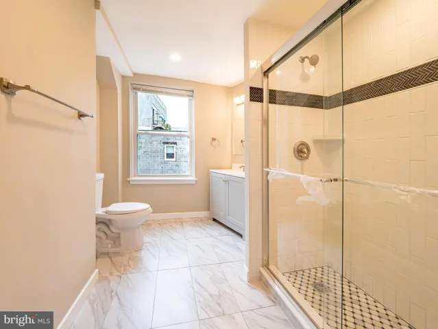 a bathroom with a sink vanity and a mirror