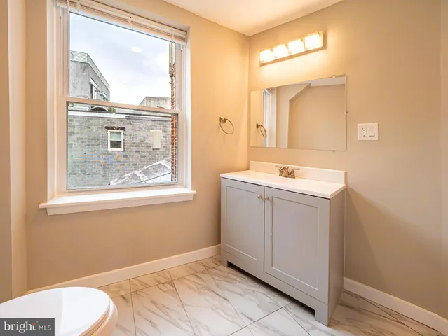 a view of hallway with wooden floor