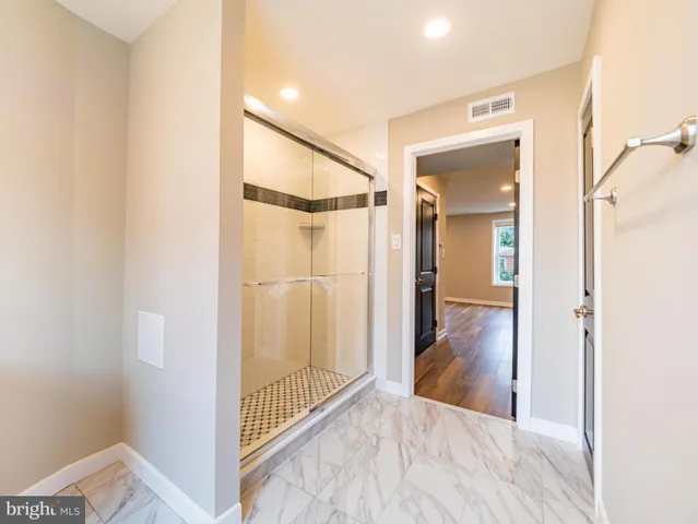 a view of a bathroom from the hallway