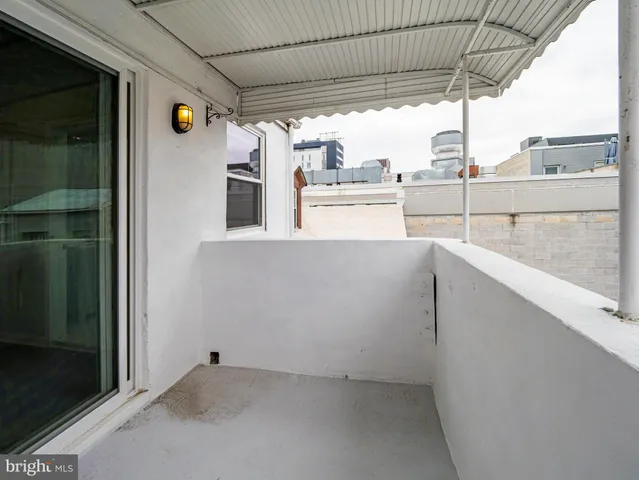 a view of a brick building with many windows