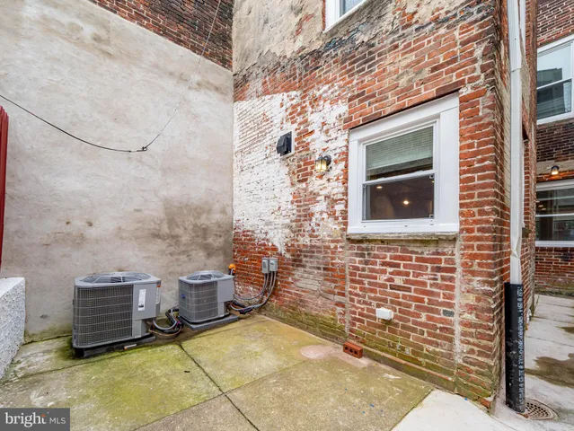 a bedroom with bed and flat screen tv