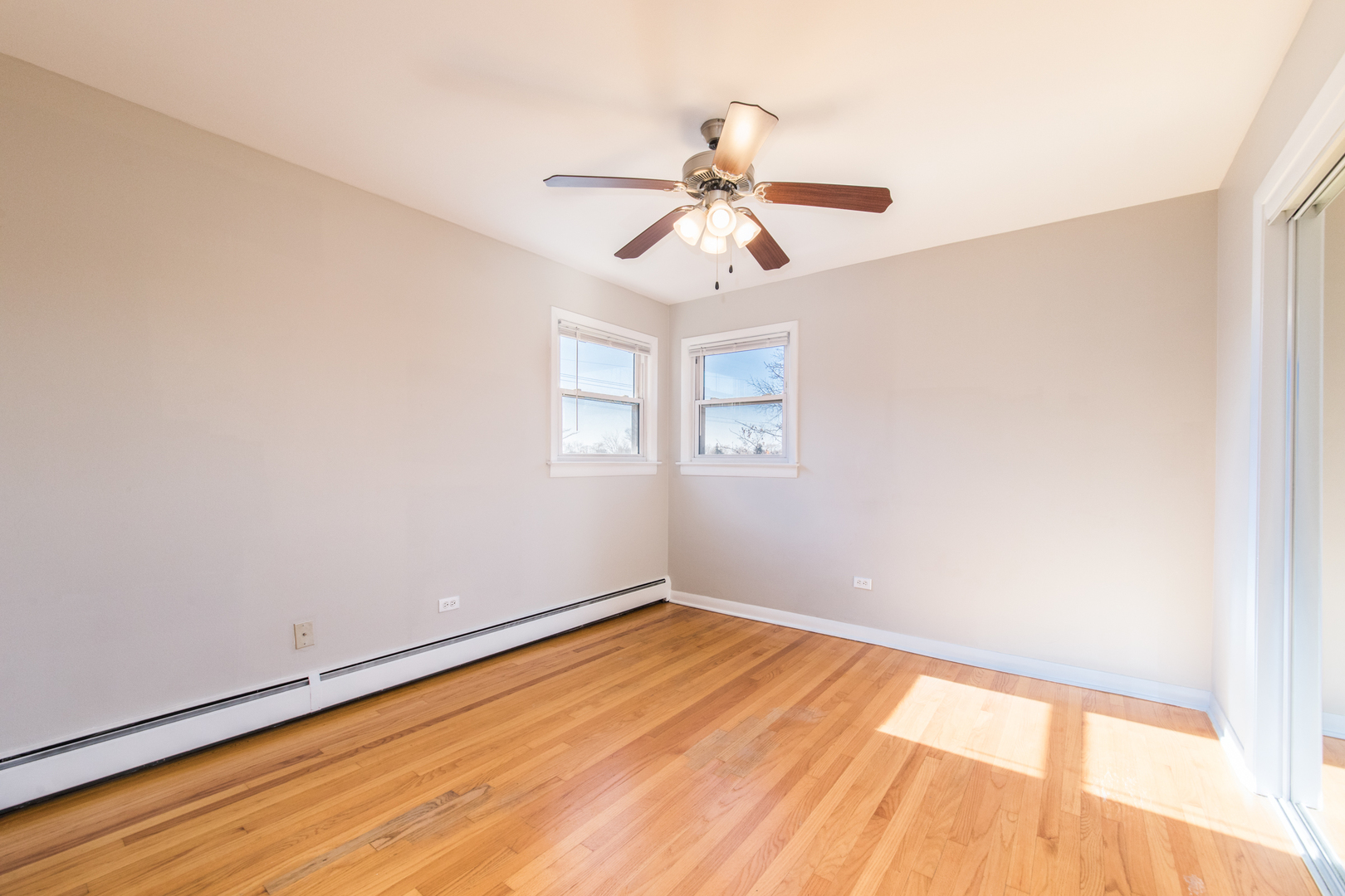 2245 Des Plaines Avenue, Unit B North Riverside, IL 60546 - Photo 12 of 22 a view of empty room with wooden floor and fan