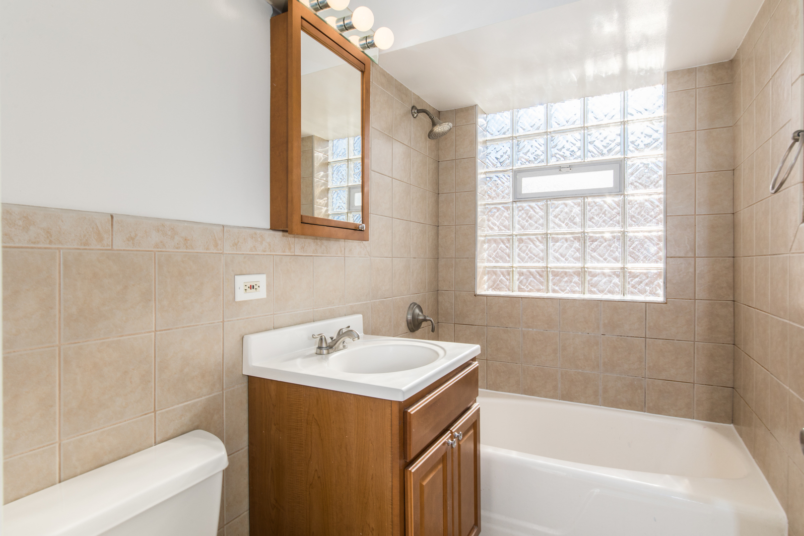 2245 Des Plaines Avenue, Unit B North Riverside, IL 60546 - Photo 14 of 22 a bathroom with a tub a sink and a window