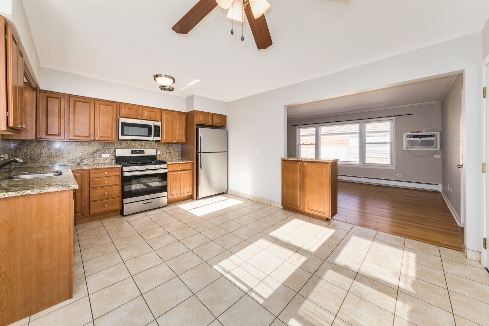 2245 Des Plaines Avenue, Unit B North Riverside, IL 60546 - Photo 6 of 22 a view of kitchen with furniture and wooden floor