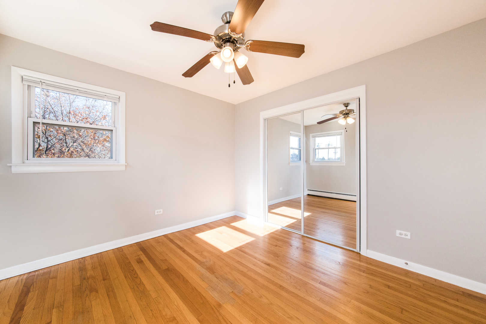 2245 Des Plaines Avenue, Unit B North Riverside, IL 60546 - Photo 10 of 22 wooden floor in an empty room with a window