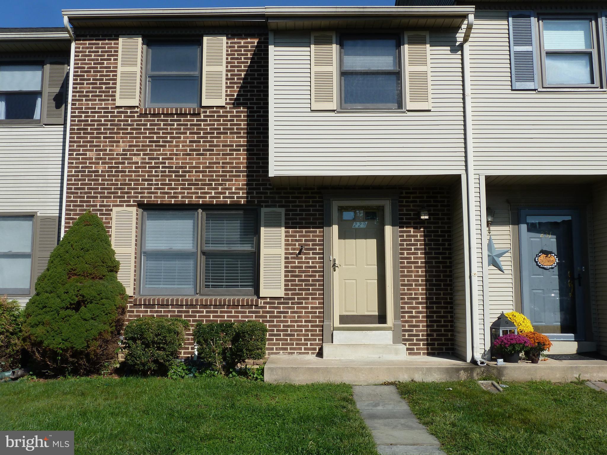 229 Sulky Way Chadds Ford, PA 19317 - Photo 1 of 21 a front view of a house with a yard and garage
