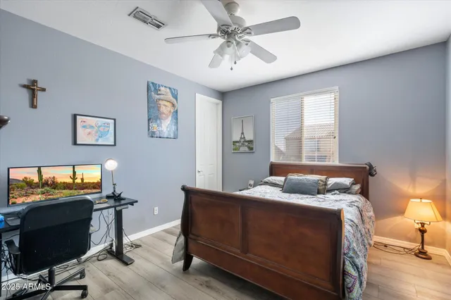a bedroom with furniture and a window