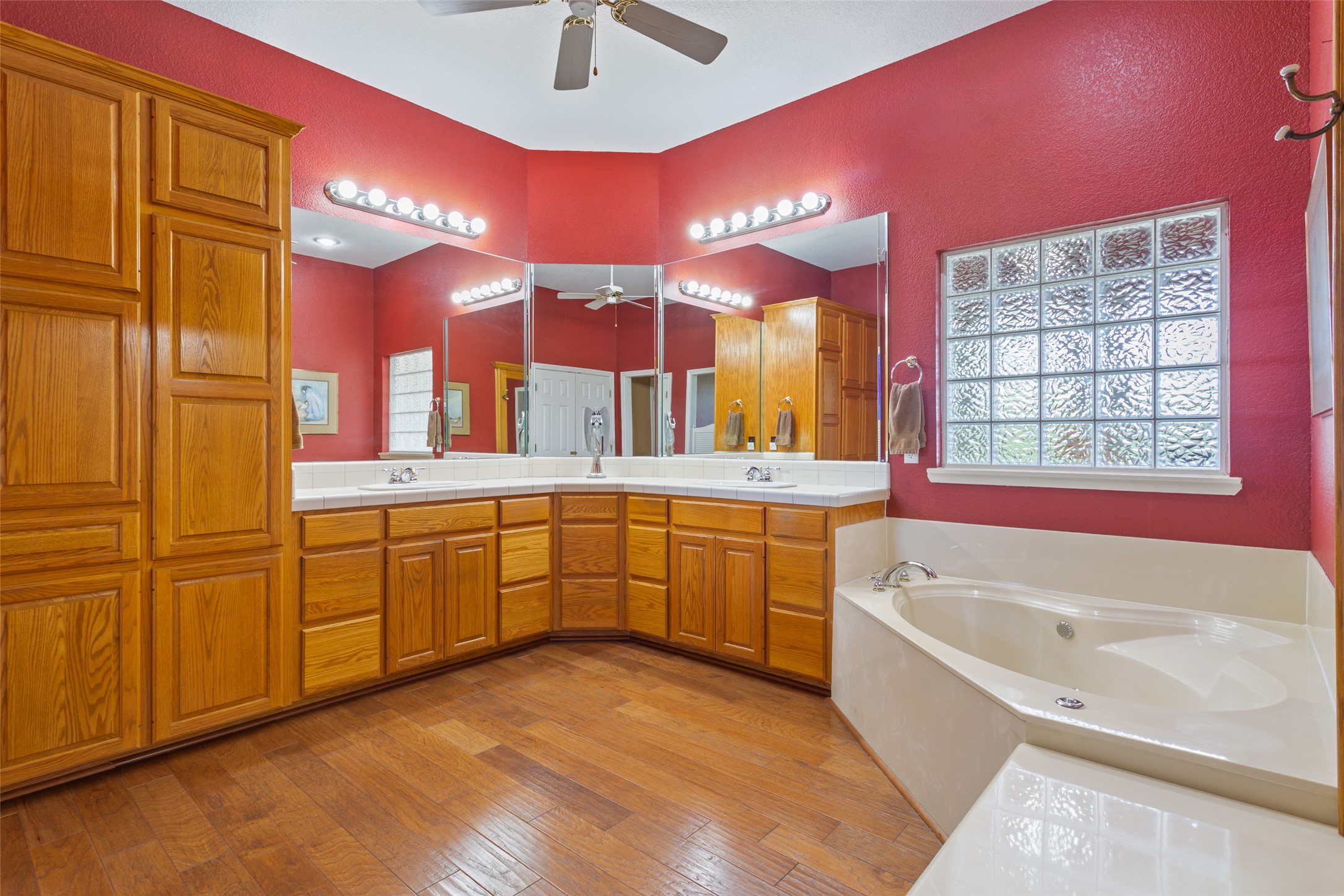 13730 Settlements Road Salado, TX 76571 - Photo 14 of 40 a bathroom with a tub a sink and a large window