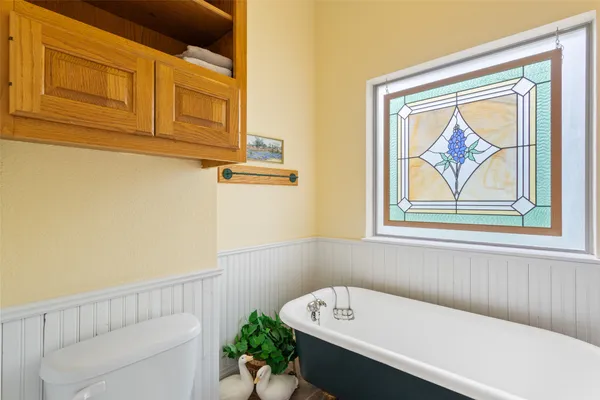 a view of a hallway with a window