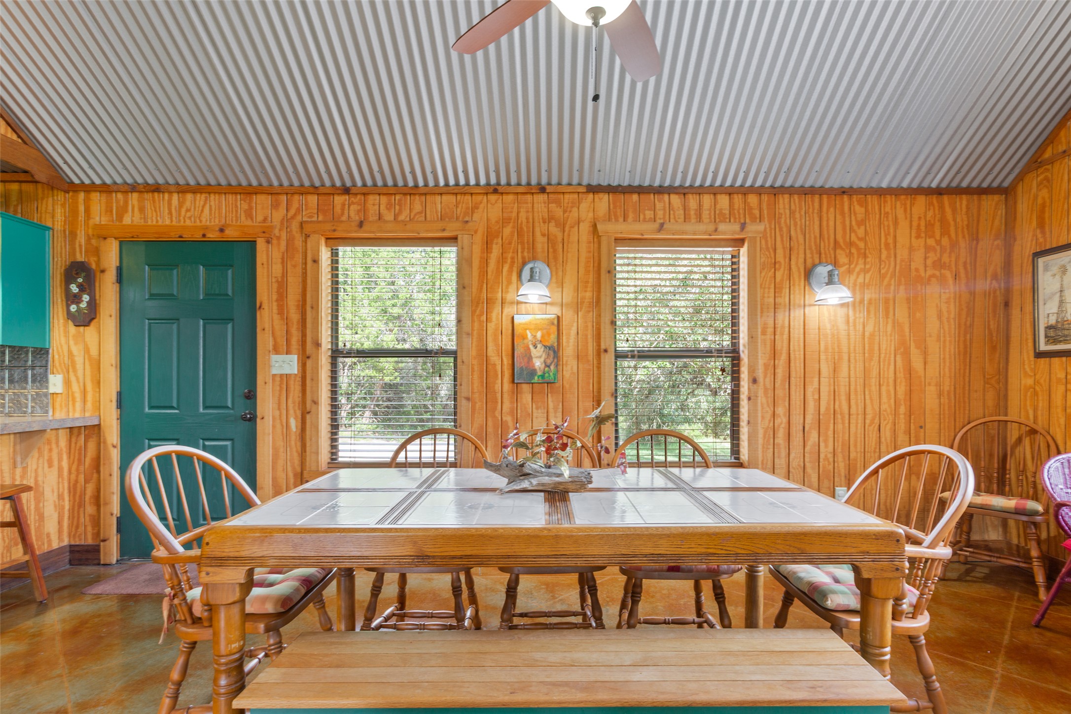 13730 Settlements Road Salado, TX 76571 - Photo 26 of 40 a dining room with furniture a large window and wooden floor