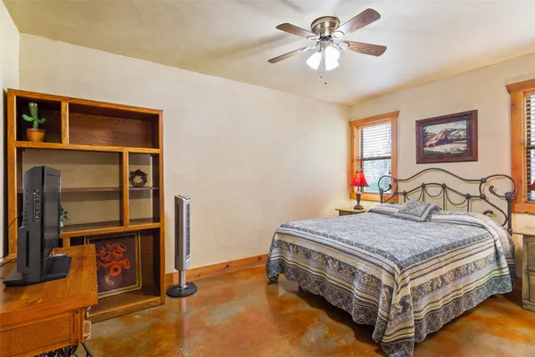a bed sitting in a room next to a window