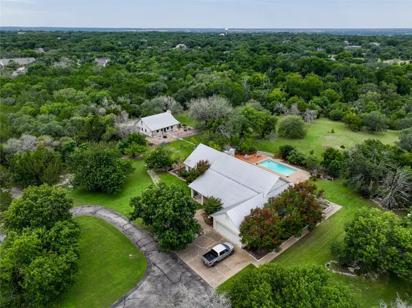 an aerial view of a house with mountain view