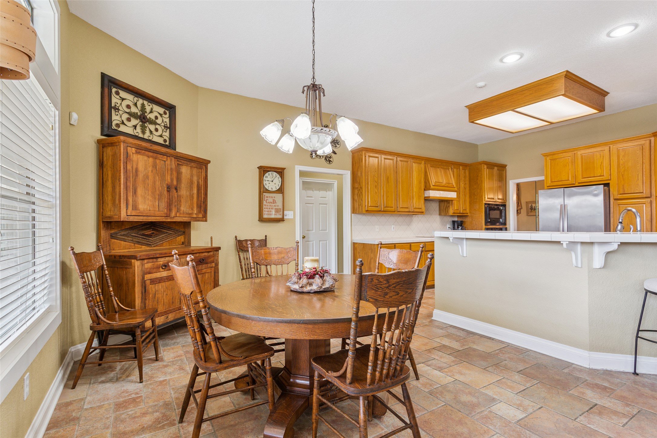 13730 Settlements Road Salado, TX 76571 - Photo 8 of 40 a view of a dining room with furniture and chandelier