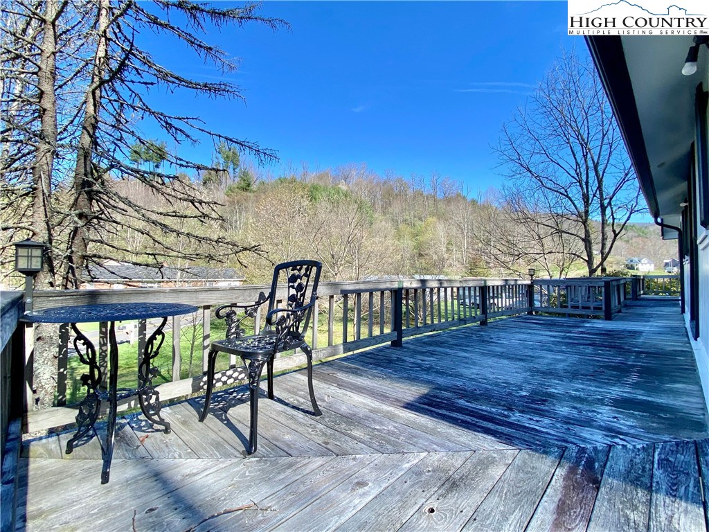 608 Fees Branch Road Lansing, NC 28643 - Photo 6 of 20 a view of a chairs and table on the wooden floor