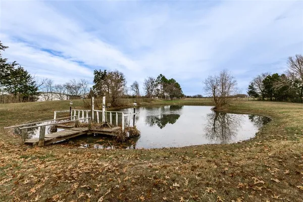 a view of a lake with houses in the back