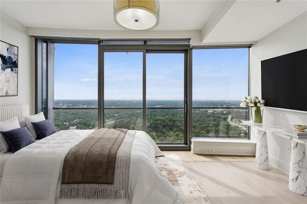 3344 Peachtree Road Northeast, Unit 4104 Atlanta, GA 30326 - Photo 13 of 30 a bedroom with a bed and large window
