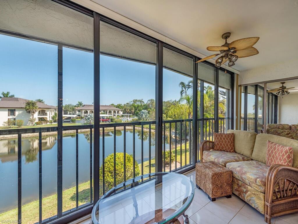 5590 Rattlesnake Hammock Road, Unit M203 Naples, FL 34113 - Photo 16 of 22 a living room with furniture