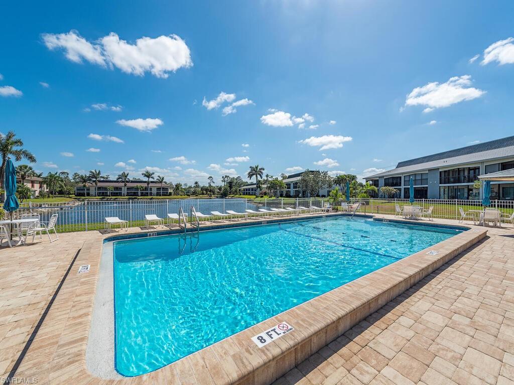 5590 Rattlesnake Hammock Road, Unit M203 Naples, FL 34113 - Photo 20 of 22 a view of swimming pool from a balcony