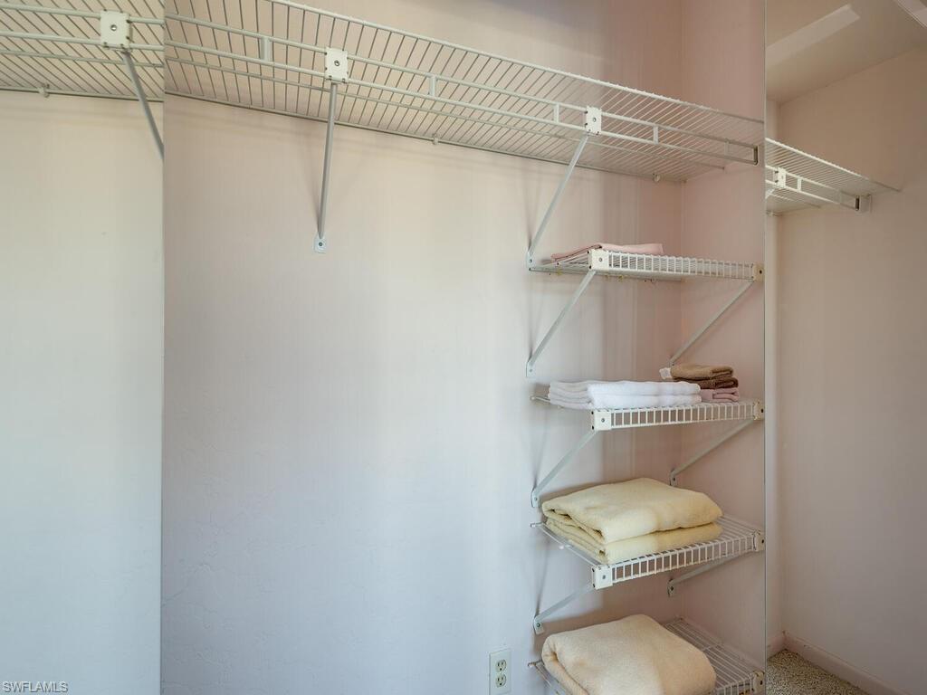 5590 Rattlesnake Hammock Road, Unit M203 Naples, FL 34113 - Photo 10 of 22 a bathroom with a toilet and a shower