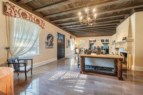 a living room with stainless steel appliances granite countertop furniture and a kitchen view