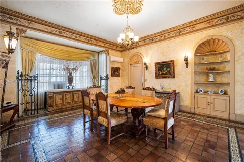 a spacious bedroom with a bed and a fireplace