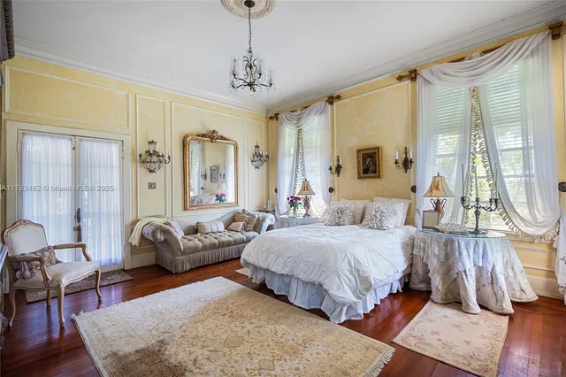 a bathroom with a tub a sink and a mirror