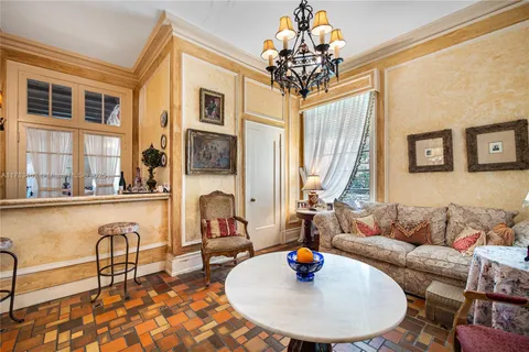 a view of a porch with wooden floor and furniture