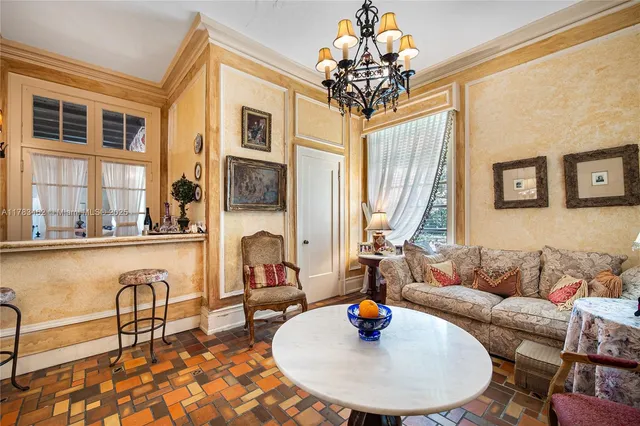 a view of a porch with wooden floor and furniture