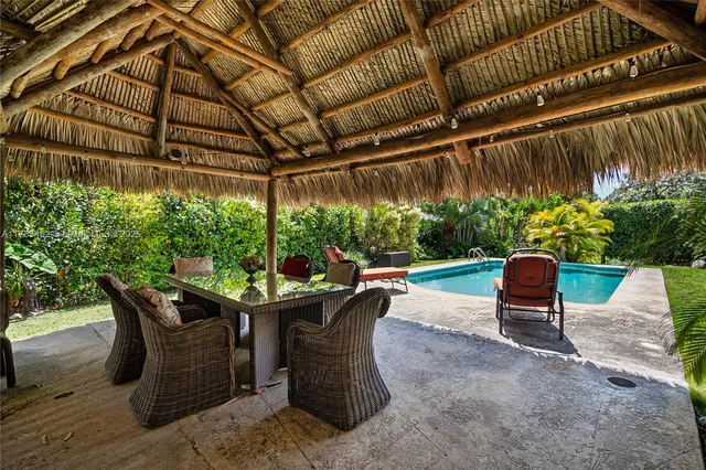 an aerial view of residential houses with outdoor space and street view