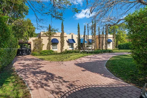 a view of a building with a yard