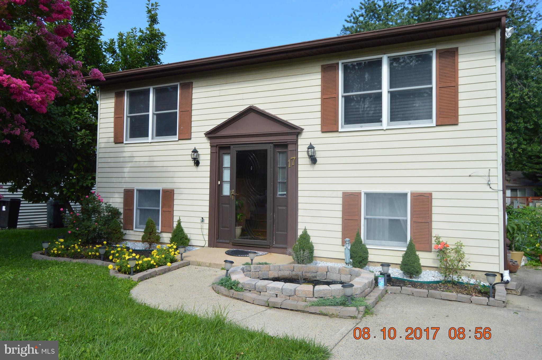 17 Rollwin Road Baltimore, MD 21244 - Photo 1 of 29 a front view of a house with garden
