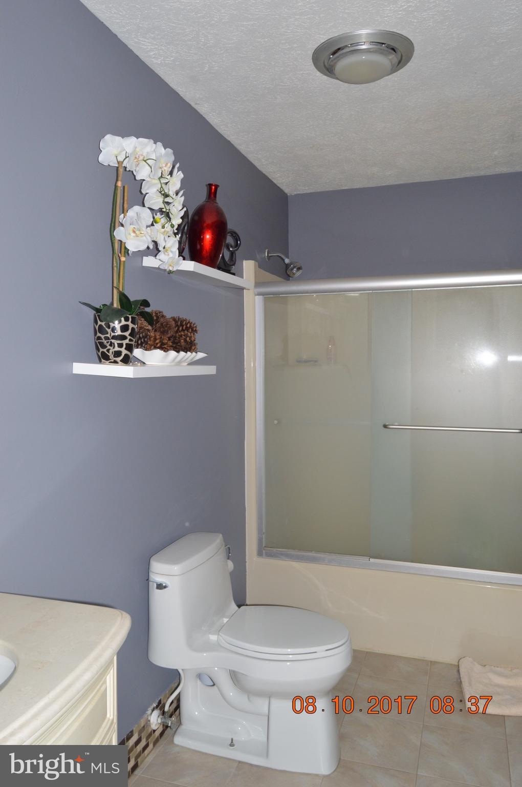 17 Rollwin Road Baltimore, MD 21244 - Photo 14 of 29 a bathroom with a toilet and a shower