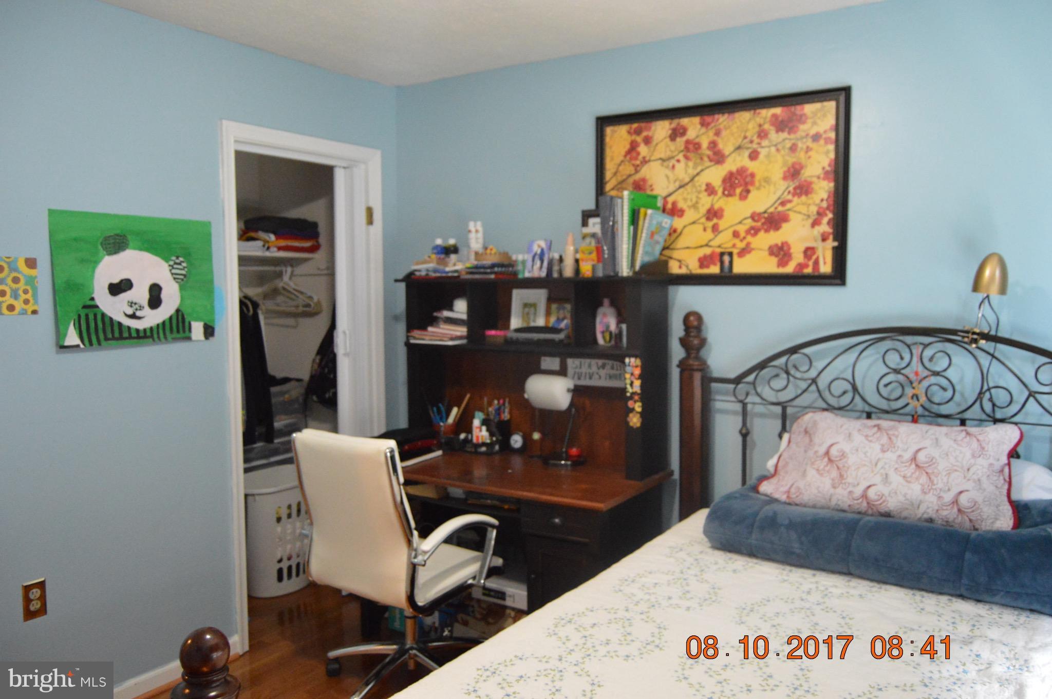 17 Rollwin Road Baltimore, MD 21244 - Photo 15 of 29 a bedroom with a bed and a bookshelf in it
