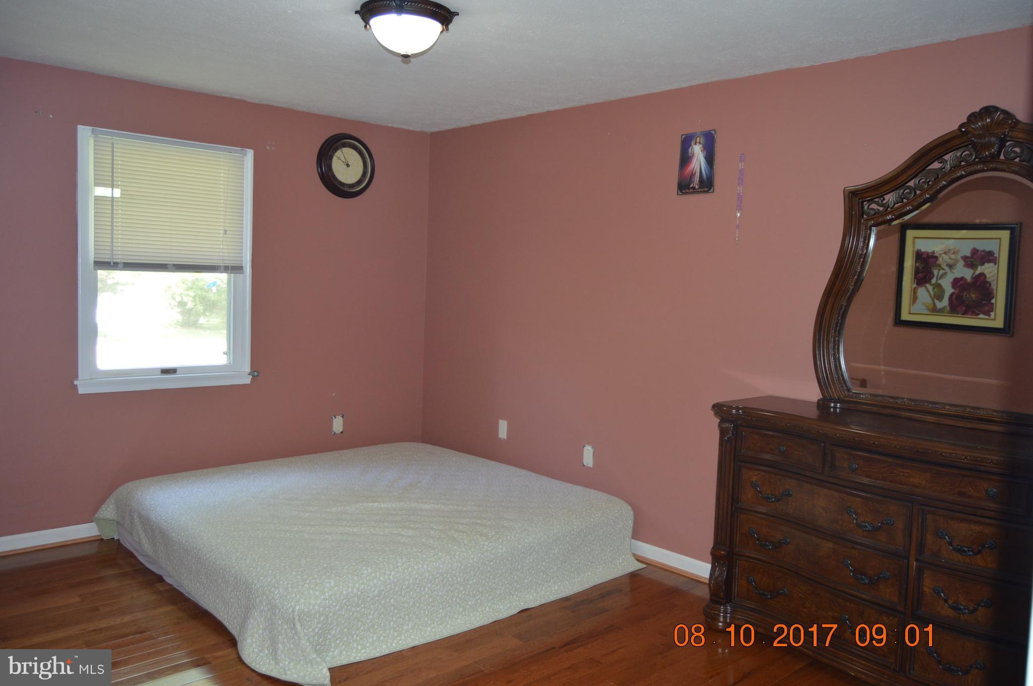 17 Rollwin Road Baltimore, MD 21244 - Photo 17 of 29 a bedroom with a bed and a dresser