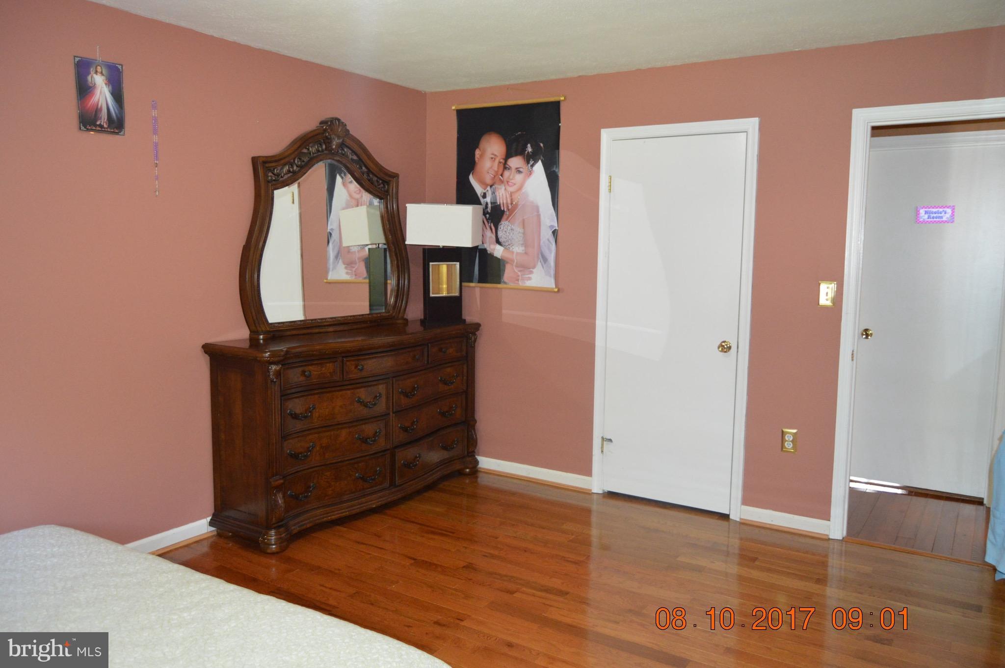 17 Rollwin Road Baltimore, MD 21244 - Photo 18 of 29 a view of a hallway with wooden floor and cabinet