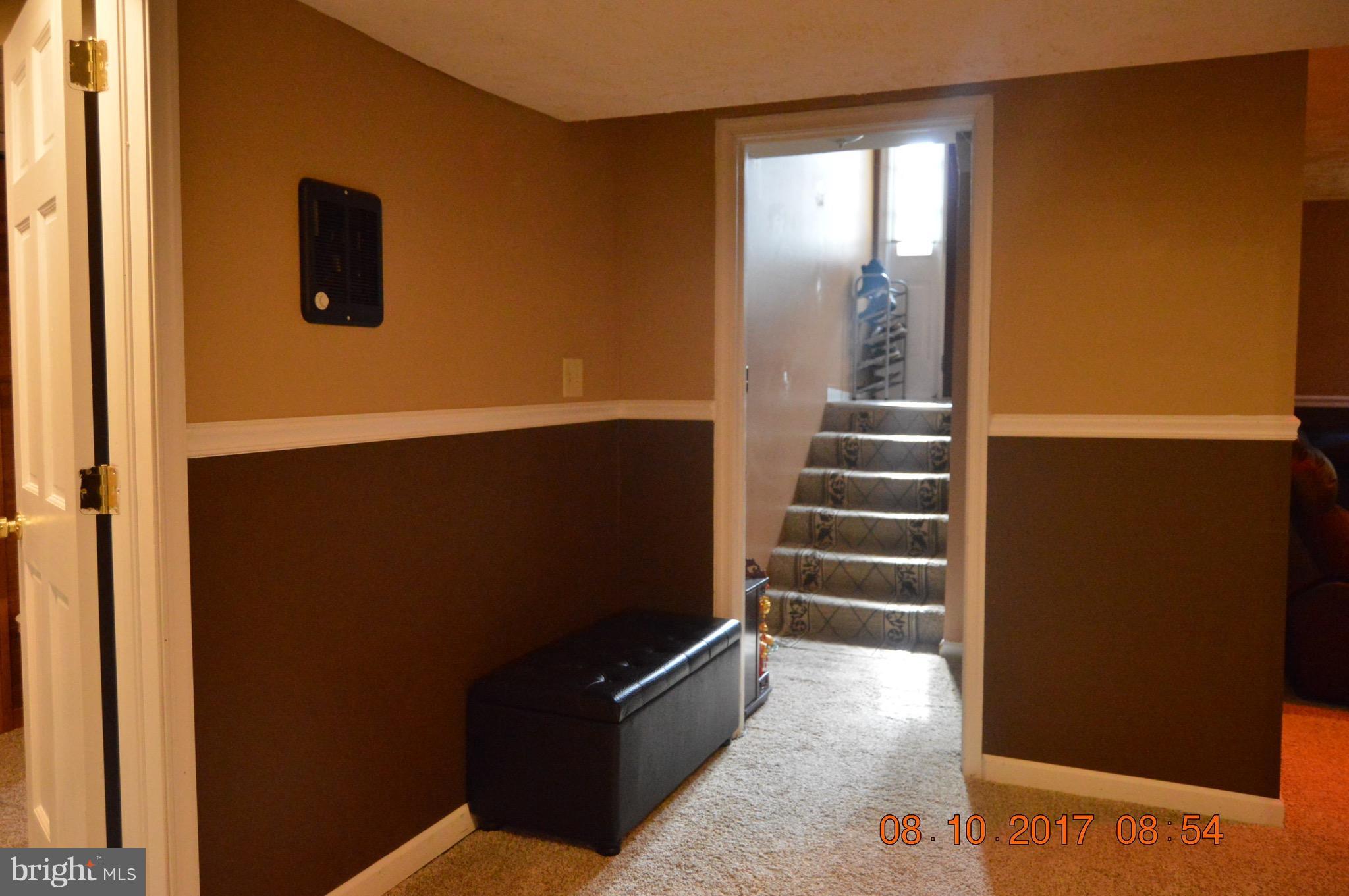 17 Rollwin Road Baltimore, MD 21244 - Photo 20 of 29 an empty room with wooden floor and windows