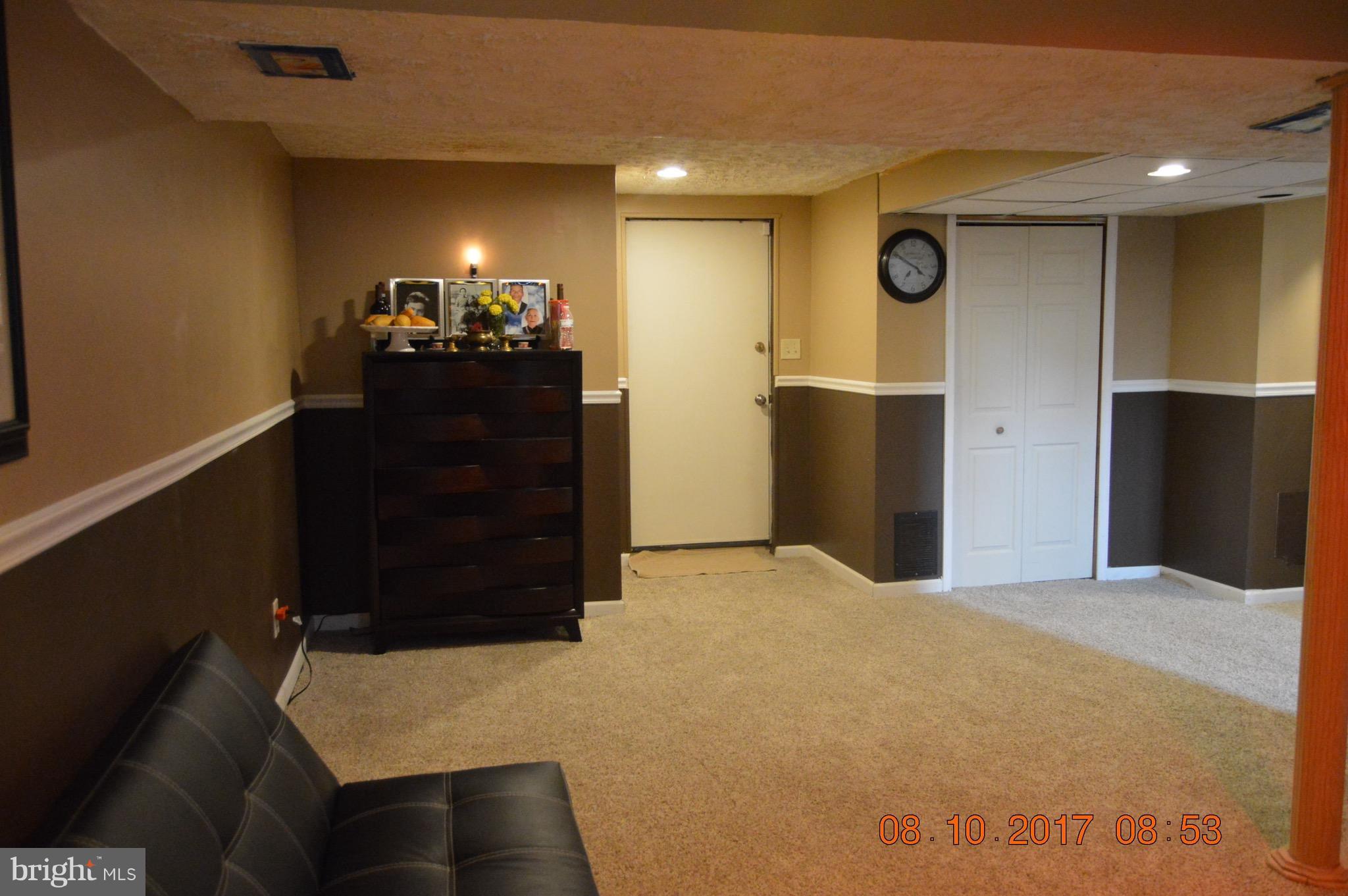 17 Rollwin Road Baltimore, MD 21244 - Photo 25 of 29 a bedroom with a bed and cabinets