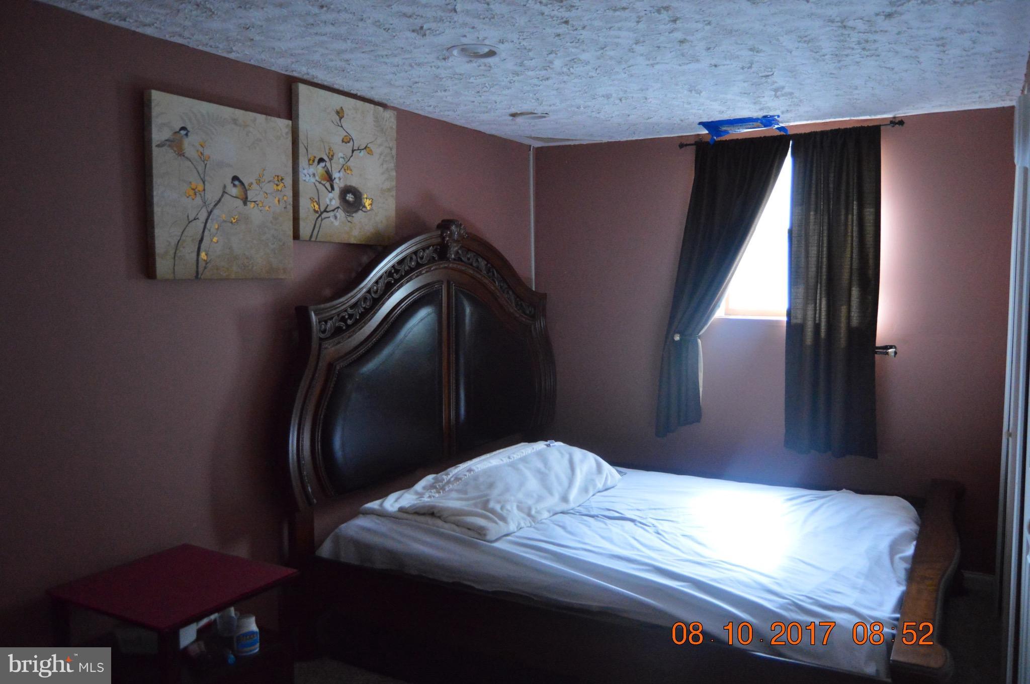 17 Rollwin Road Baltimore, MD 21244 - Photo 26 of 29 a bedroom with a bed and the painting on the wall