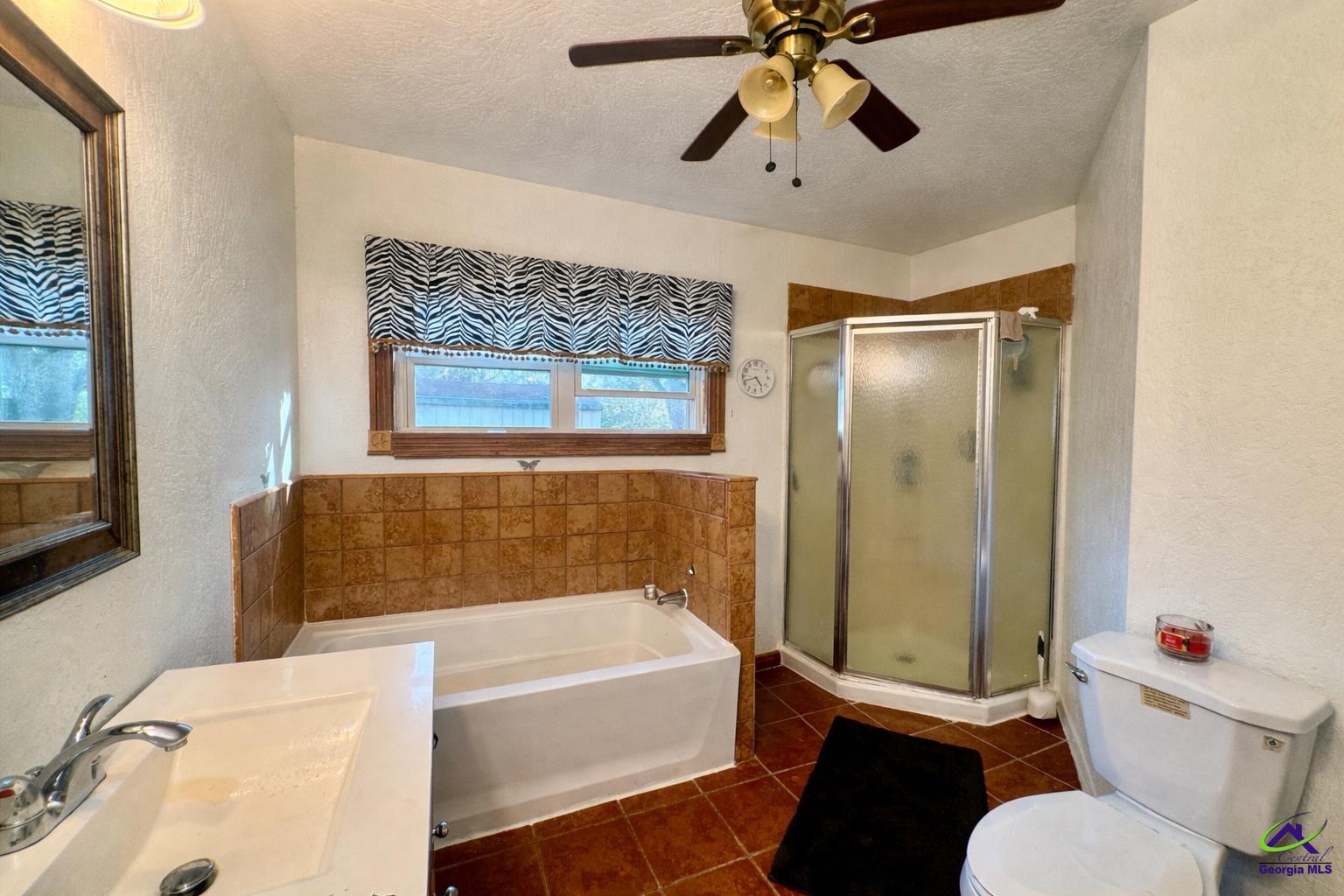 914 Adderton Street Americus, GA 31719 - Photo 53 of 53 a bathroom with a tub toilet and sink