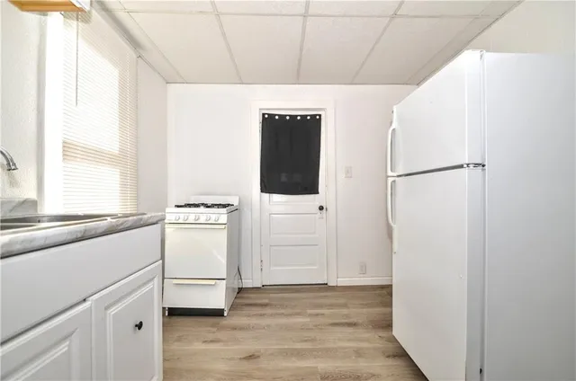 a view of a hallway with washer and dryer