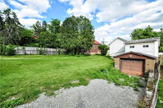 a backyard of a house with lots of green space