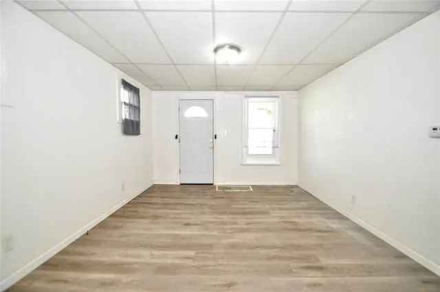 a view of an empty room with a window