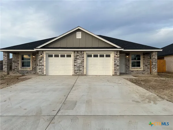 a front view of a house with a garage