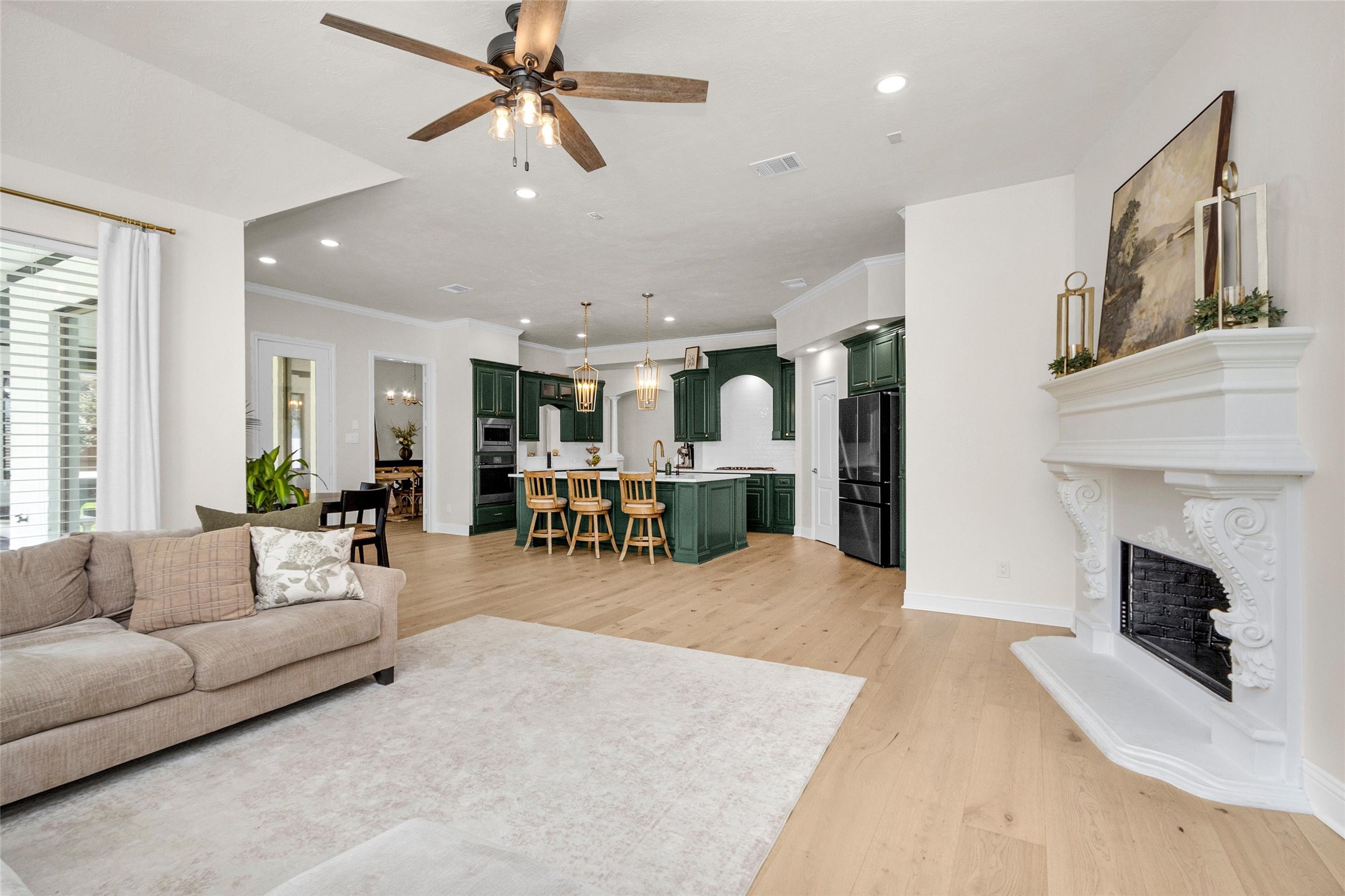 10004 Summer Ridge Lane Conroe, TX 77302 - Photo 24 of 50 a living room with furniture and a fireplace