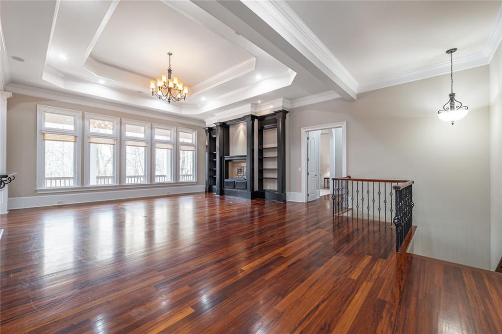 250 Frank Bruce Road Dawsonville, GA 30534 - Photo 11 of 110 wooden floor in an empty room with a window