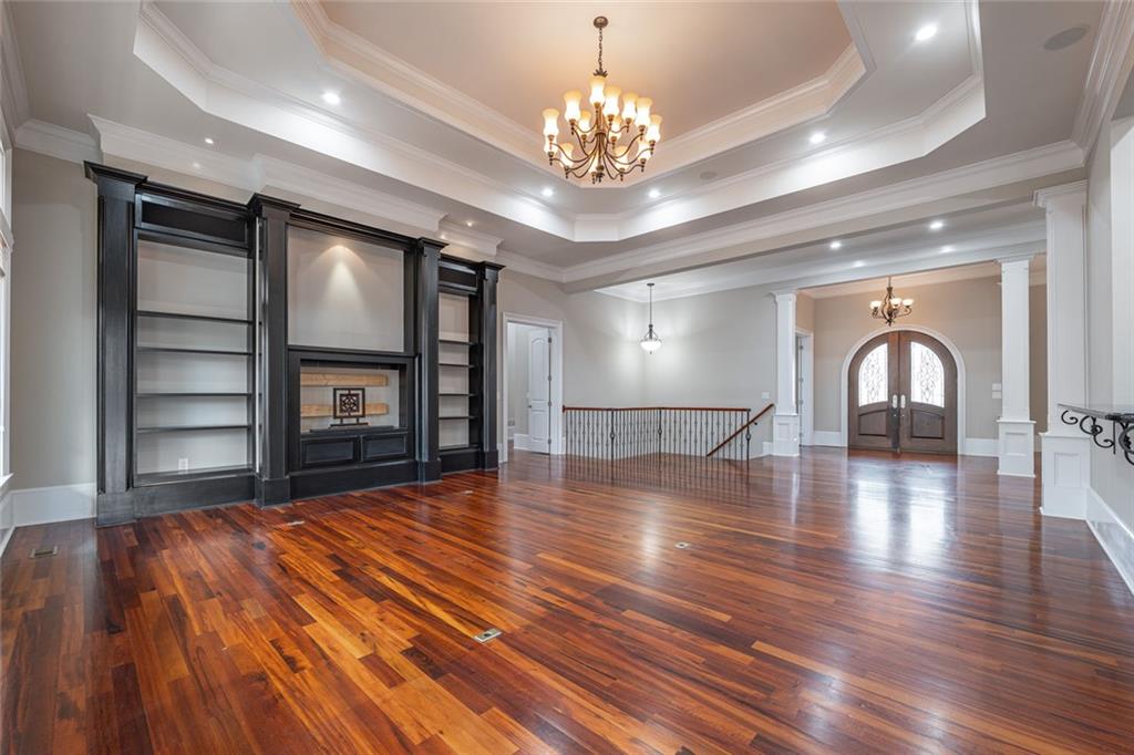 250 Frank Bruce Road Dawsonville, GA 30534 - Photo 12 of 110 a view of an empty room with wooden floor and a window