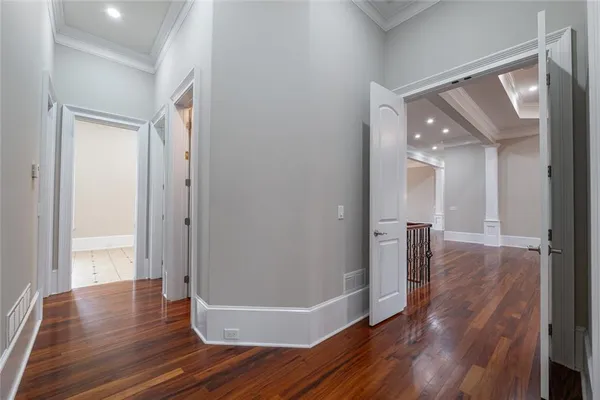 an empty room with a ceiling fan and carpet