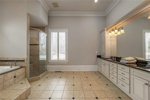 a kitchen with stainless steel appliances granite countertop a stove and a sink